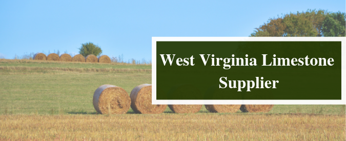 hay bales in a field with a green sign that says "West Virginia Limestone Supplier"